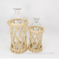 large ratten wrapped clear glass bottles with handle